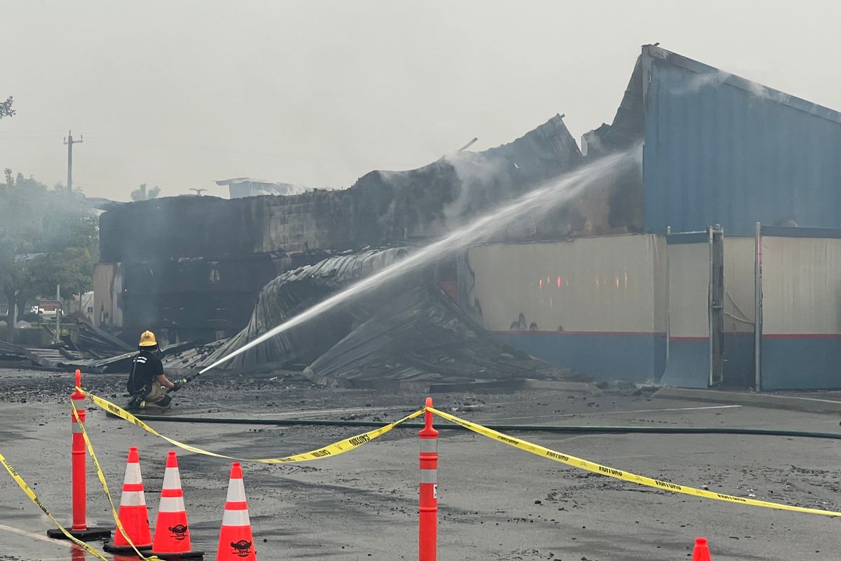 Firefighters continued to dose the fire that destroyed the concession building at Avista Stadium Friday morning, Sept. 5, 2025.  (Jonathan Brunt/The Spokesman-Review)