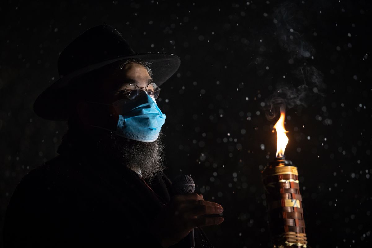 Rabbi Yisroel Hahn leads Chabad of Spokane’s annual menorah lighting for Hanukkah in Riverfront Park on Sunday. The event included a car parade, a public gathering in the park and participation by local leaders.  (Libby Kamrowski/ THE SPOKESMAN-REVIEW)