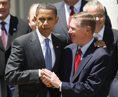 President Barack Obama shakes hands with Ford Chief Executive Officer Alan Mulally in the Rose Garden of the White House in Washington on Tuesday. (Associated Press / The Spokesman-Review)
