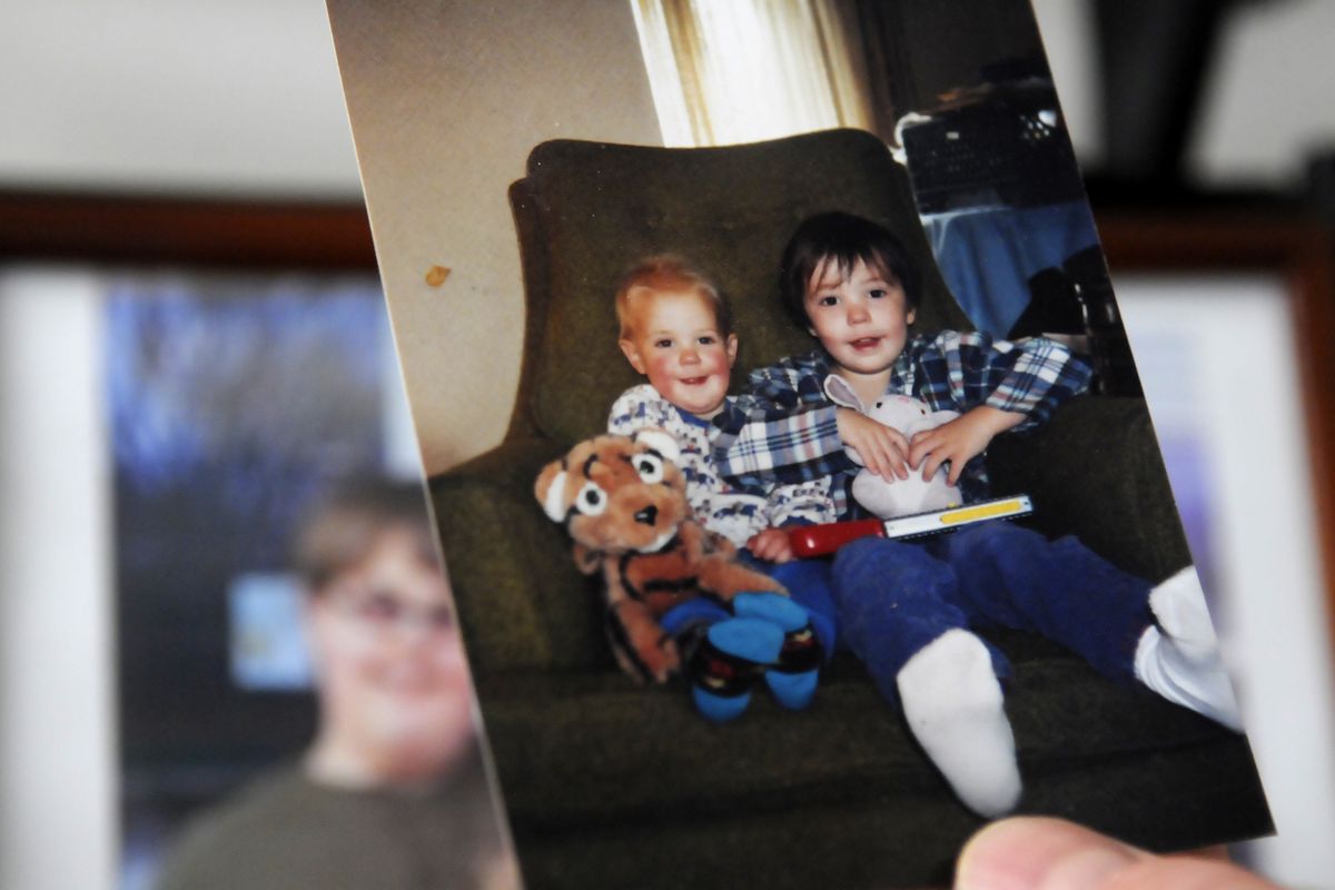 Bill Connington has kept this snapshot of his two sons at hand since his ex-wife took the boys and left the area almost 12 years ago. (Jesse Tinsley)