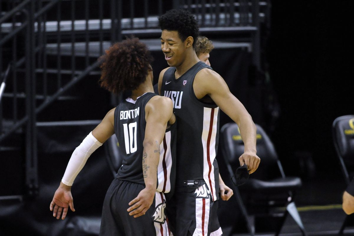 Washington State guard Isaac Bonton (10) celebrates with center Dishon Jackson (21) after the team