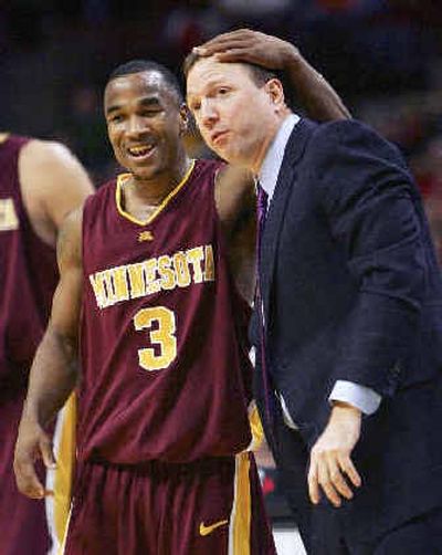 
Minnesota's Aaron Robinson celebrates with head coach Dan Monson at the end of their Big Ten quarterfinal win over Indiana. 
 (Associated Press / The Spokesman-Review)