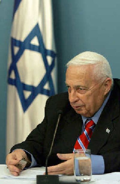 
Israeli Prime Minister Ariel Sharon speaks during a press conference at his Jerusalem office on Monday. Sharon broke away from his hardline Likud Party on Monday to form a new centrist party and push for a snap election. 
 (Associated Press / The Spokesman-Review)
