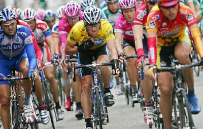 
Overall leader Lance Armstrong, center, adjusts his jersey during Friday's seventh stage of the Tour de France. 
 (Associated Press / The Spokesman-Review)