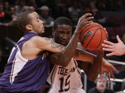 
Aggies guard Donald Sloan, right, battles Venoy Overton for two of his 18 points.Associated Press
 (Associated Press / The Spokesman-Review)