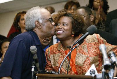 Rep. Cynthia McKinney, D-Ga., is greeted with a kiss by Georgia state Rep. Tyrone Brooks, D-Atlanta, as she prepares to address the media at a news conference Monday in Atlanta. 
 (Associated Press / The Spokesman-Review)