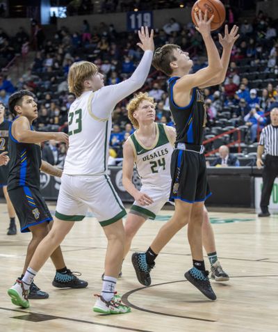 Wellpinit’s William Dick pressures DeSales’ Jack Lesko at the State 1B boys basketball tournament Wednesday in Spokane.  (JESSE TINSLEY/THE SPOKESMAN-REVIEW)