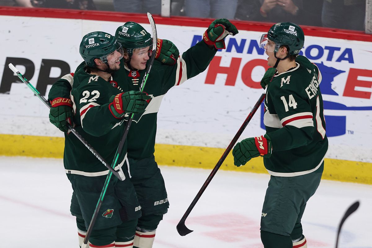 Minnesota Wild center Joel Eriksson Ek (14) looks to teammates after scoring a goal against the Seattle Kraken during the first period of an NHL hockey game, Friday, April 22, 2022, in St. Paul, Minn.  (Stacy Bengs)
