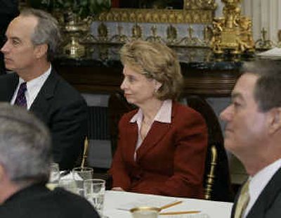 
Gov. Christine Gregoire of Washington listens as President Bush addresses the National Governors Association annual winter meeting, in the State Dining Room of the White House on Monday. At left is Gov. Dirk Kempthorne of Idaho. 
 (Associated Press / The Spokesman-Review)