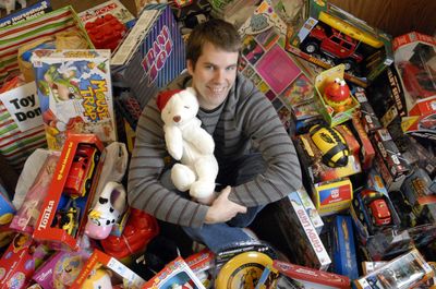 Opportunity Presbyterian Church Youth director Brad Hauge sits among toys donated to the Christmas Toy Store at the church Tuesday. People donate new toys which will be sold at discounts to low-income families.  (J. BART RAYNIAK / The Spokesman-Review)