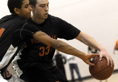 Post Falls High School senior Justin Carter, right, goes against Shawn Reid during practice at the school  Jan. 9.  (Kathy Plonka / The Spokesman-Review)