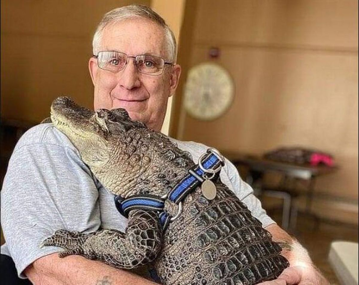 Joie Henney holds WallyGator after dropping off food donations for a local charity last summer.  (Courtesy of Joie Henney)