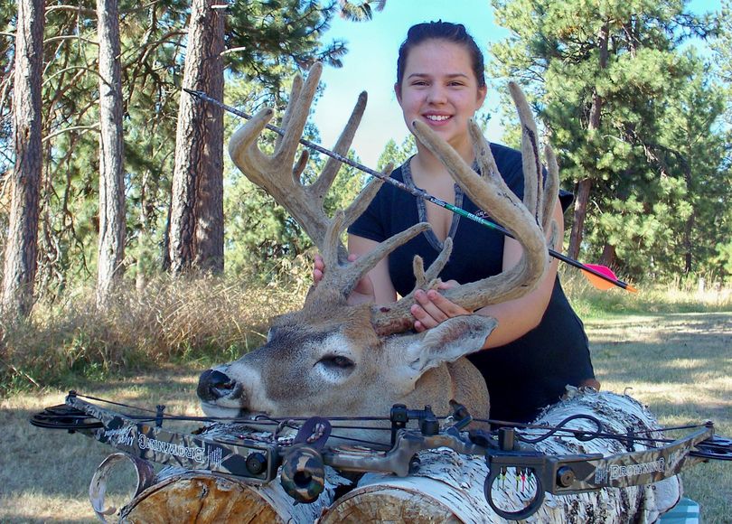 LaFawn Sutton, 12, bagged this record-book whitetail buck in velvet during the September early bowhunting season near her Mount Spokane area home.  (Jim Sutton)