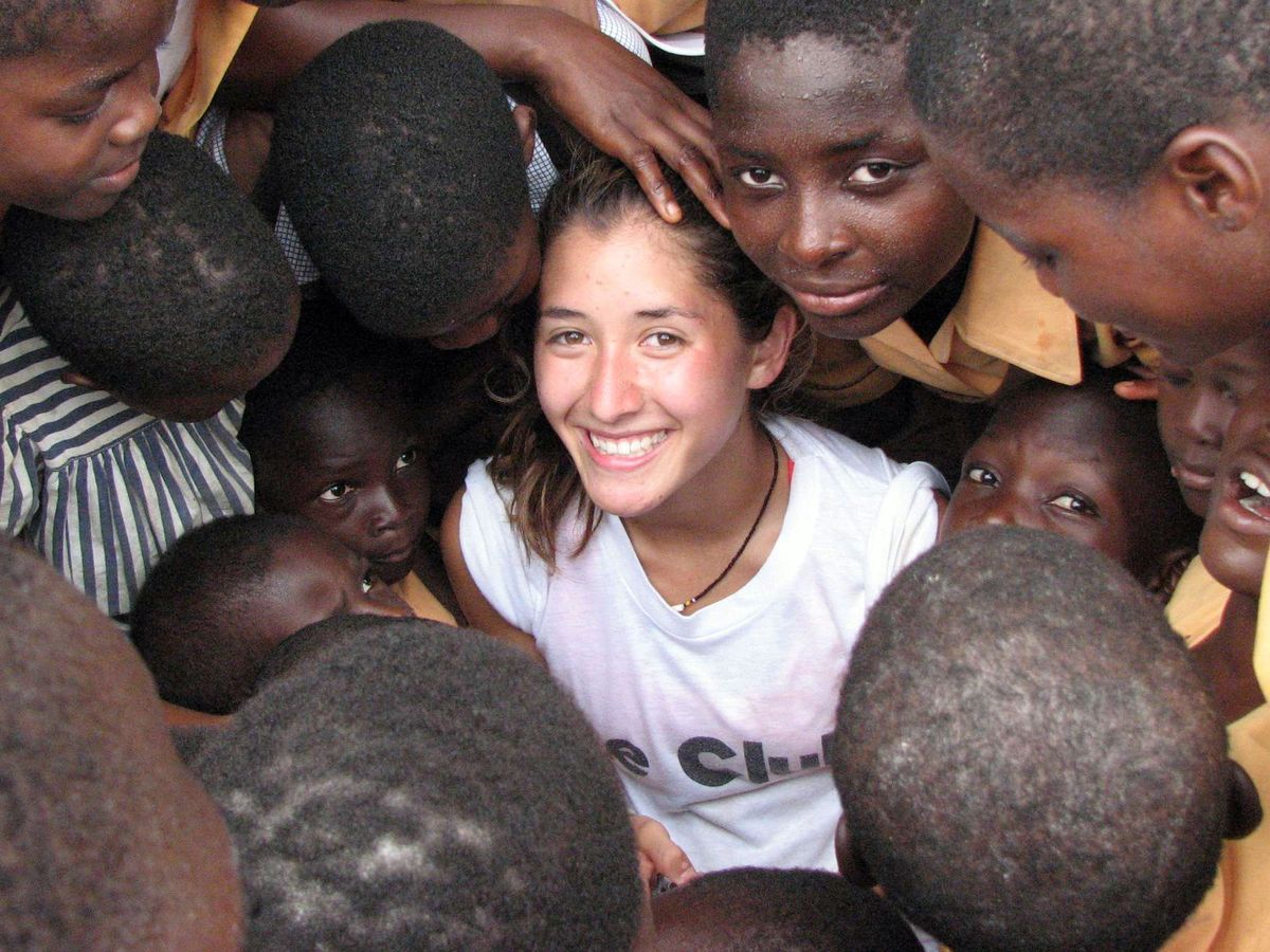 Kana Maeji, center, who took working vacation through Global Volunteers, is shown  with children on her trip  in Ghana.  (Associated Press / The Spokesman-Review)