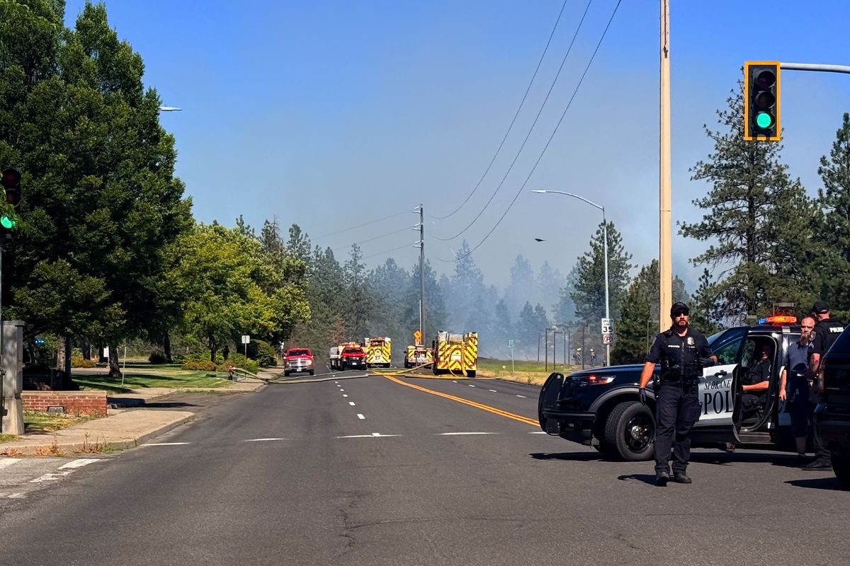 Smoke seen Tuesday afternoon from the Elliott fire along the Spokane River near the T.J. Meenach Bridge.  (Alexandra Duggan / The Spokesman-Review)