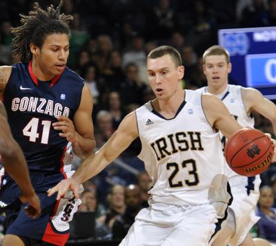 Notre Dame guard Ben Hansbrough, right, heads up court as Gonzaga guard Steven Gray defends during first half action in an NCAA  college basketball game Saturday Dec. 11, 2010 in South Bend, Ind. (Joe Raymond / Fr25092 Ap)
