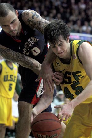 San Francisco's Cody Doolin (45) and Gonzaga's Robert Sacre, left, battle for a rebound during the first half of an NCAA college basketball game in San Francisco, Saturday, Feb. 18, 2012. (Matt Sumner / Fr170005 Ap)