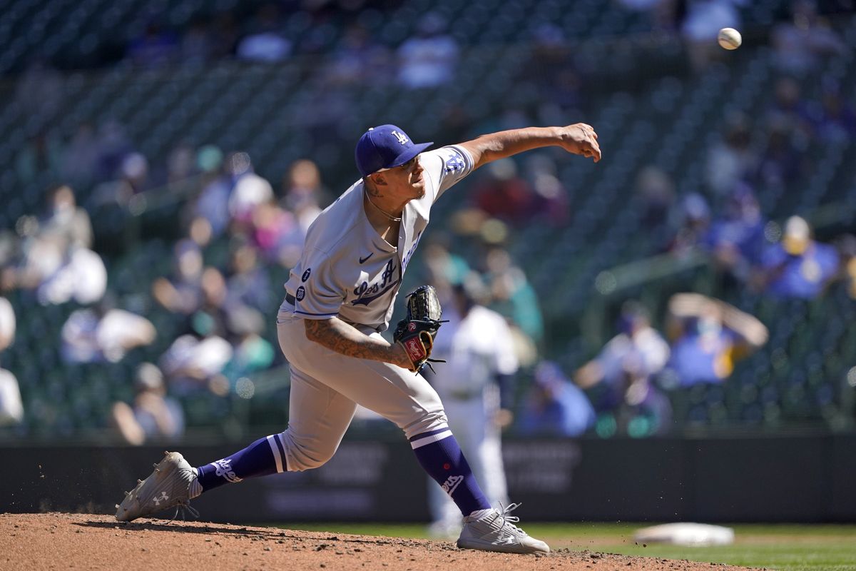 Los Angeles Dodgers starting pitcher Julio Urias throws against the Seattle Mariners in the fourth inning of a baseball game Tuesday, April 20, 2021, in Seattle.  (Associated Press)
