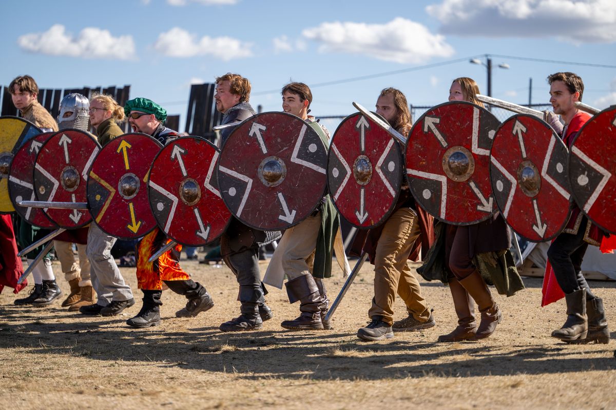 Performers gather for a mock battle in the Viking section Saturday during the Spokane Renaissance Faire at the Spokane County Fair and Expo Center. (ANGELA SCHNEIDER/The Spokesman-Review)