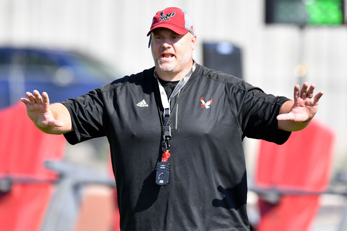 Eastern Washington head coach Aaron Best calls a play during the Eagles’ first fall practice on Thursday in Cheney.  (Tyler Tjomsland/The Spokesman-Review)
