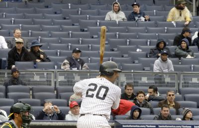 Jorge Posada bats in front of a lot of empty seats.  (Associated Press / The Spokesman-Review)