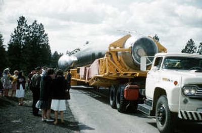 
Atlas-E ICBM Serial on transport trailer passing public observers, prior to arrival ceremony at LC 567-3, in Worley, April 17, 1961.  Images courtesy of Bill Hickman
 (Images courtesy of Bill Hickman / The Spokesman-Review)