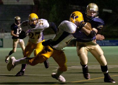 
Mead running back Luke Hattrop, right, rushed for 66 yards in a 4A state play-in game against Wenatchee on Tuesday at Albi Stadium.
 (Jed Conklin / The Spokesman-Review)