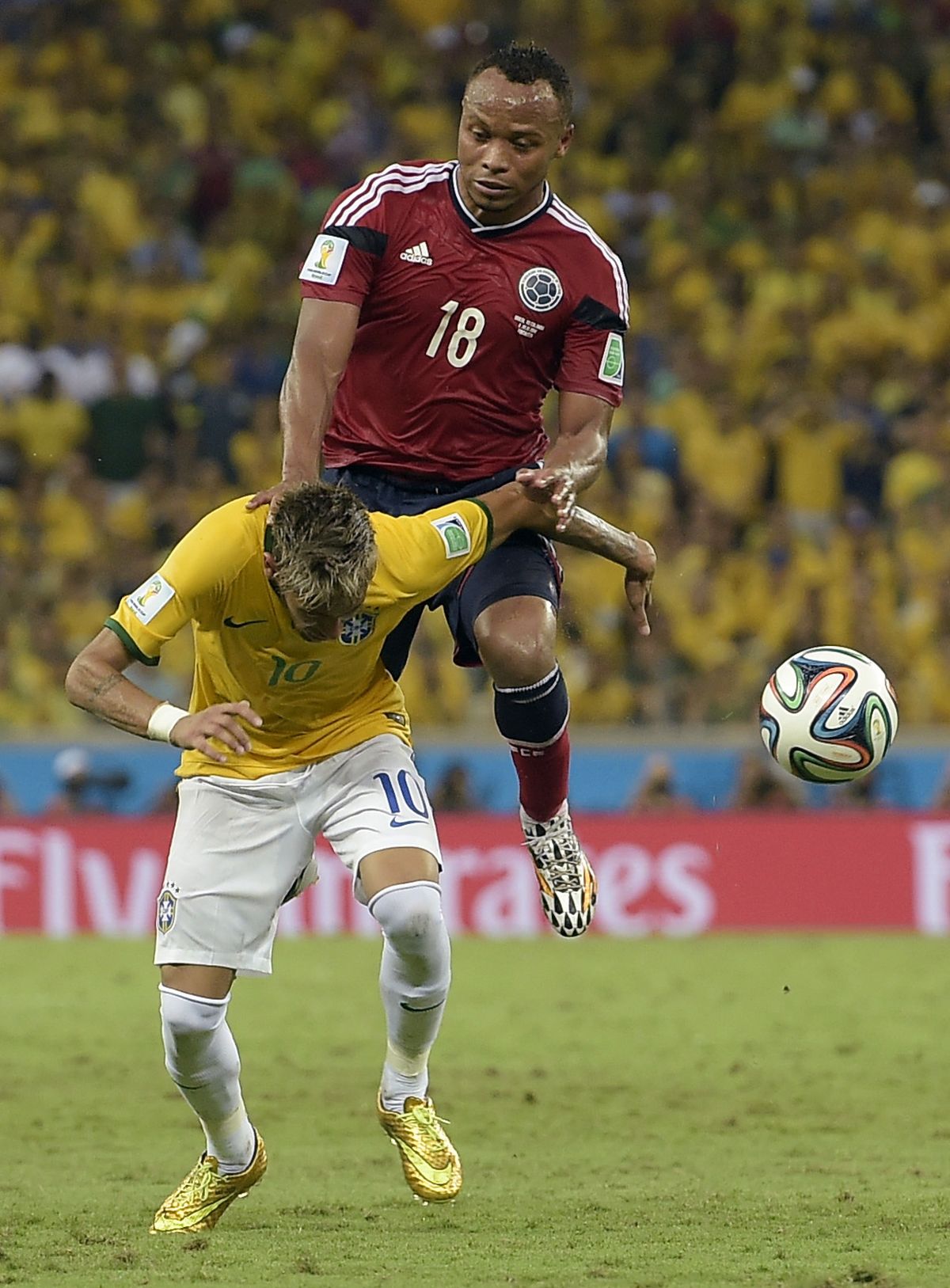 Brazil’s Neymar had a vertebra broken on this foul by Juan Zuniga to knock him out of World Cup. (Associated Press)