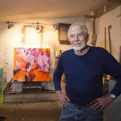 Artist Mel McCuddin stands in his art studio, Wednesday, Jan. 14, 2016, in Spokane Valley. McCuddin art has been called figurative expressionism. (Jesse Tinsley / The Spokesman-Review)