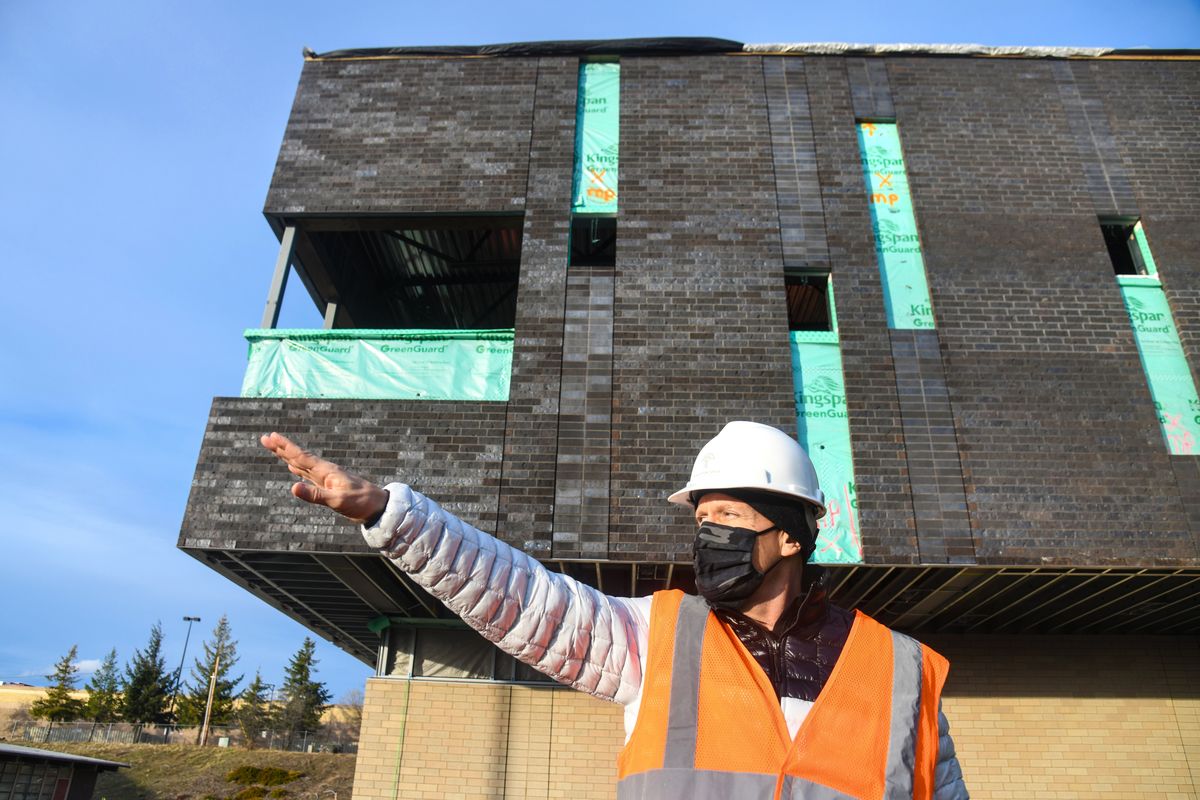 Greg Forsyth, director of Capital Projects for Spokane Public Schools, points out how the new Glover Middle School exercise area behind him is a tribute to the Spokane River and the Bowl and Pitcher.  (DAN PELLE/THE SPOKESMAN-REVIEW)