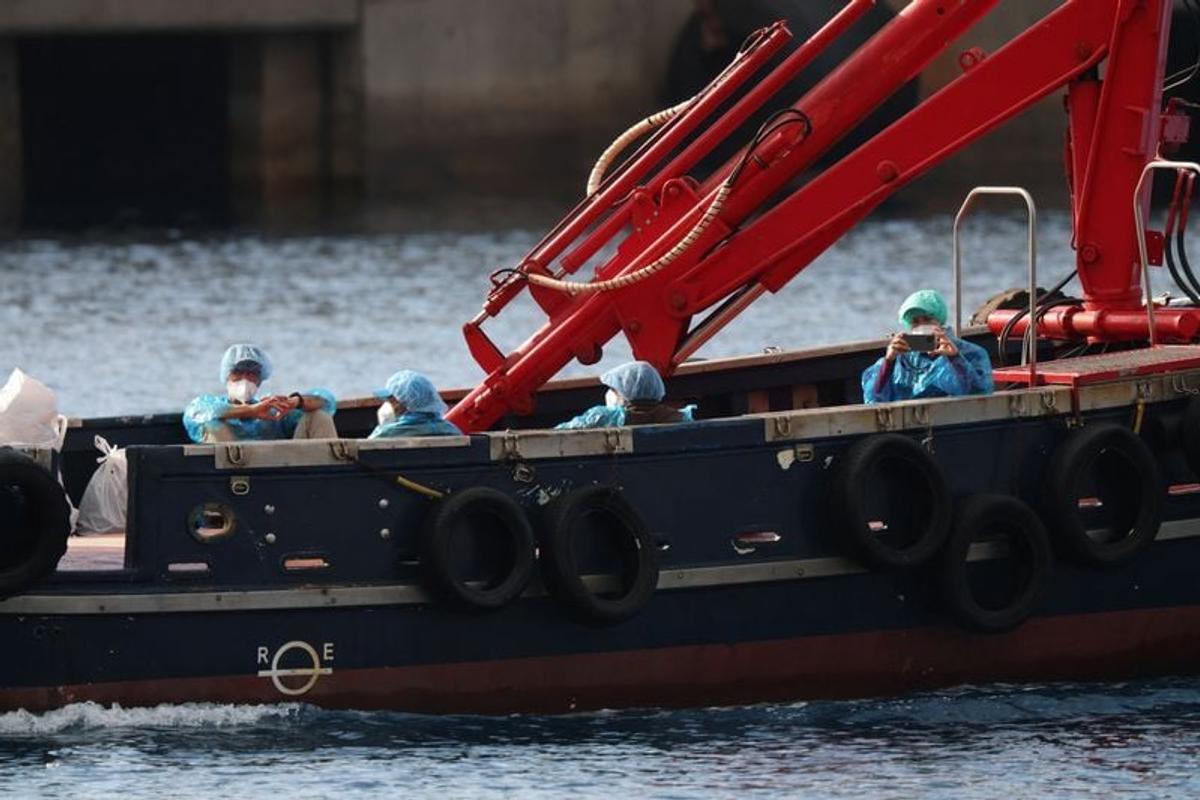 People from the cruise ship MV Hondius, affected by a hantavirus outbreak, are transferred by boat to the port after disembarking, at the port of Granadilla de Abona, on Sunday, in Tenerife, Spain.  (Reuters )