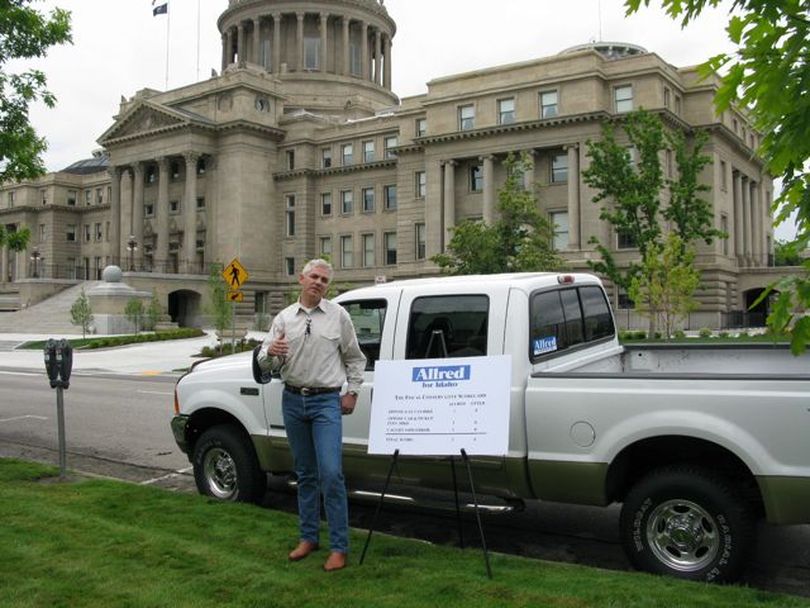 Democratic gubernatorial candidate Keith Allred with his pickup truck, discussing car and truck registration fees (Betsy Russell)
