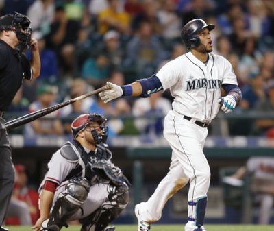 Seattle’s Robinson Cano launches a solo home run off of Arizona’s Robbie Ray in the sixth inning to pull the Mariners within 3-2. (Associated Press)