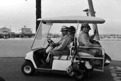 
Firefighters travel via  golf cart at Avalon on Santa Catalina Island off California's coast  on Friday.  Avalon was mostly spared by the wildfire on the island. 
 (Associated Press / The Spokesman-Review)