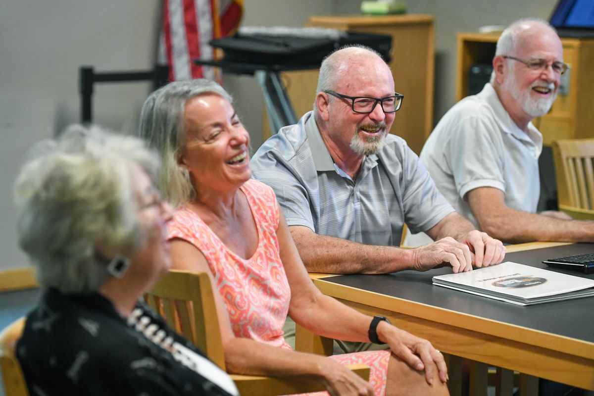 Phyllis Holmes, left, Molly Jakubczak, K.C. Traver and Dick Raymond, members of the Inland Empire Rail Transit Association, break out in laughter Friday as Jakubczak says, “When we started this project, none of us had gray hair.”  (DAN PELLE/THE SPOKESMAN-REVIEW)