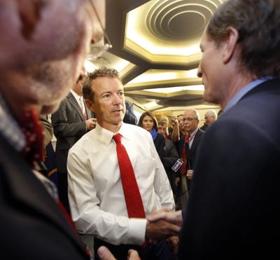 Republican presidential hopeful Sen. Rand Paul, R-Ky., shakes hands after speaking at the Republican Leadership Summit Saturday, April 18, 2015, in Nashua, N.H. (Jim Cole / AP Photo)