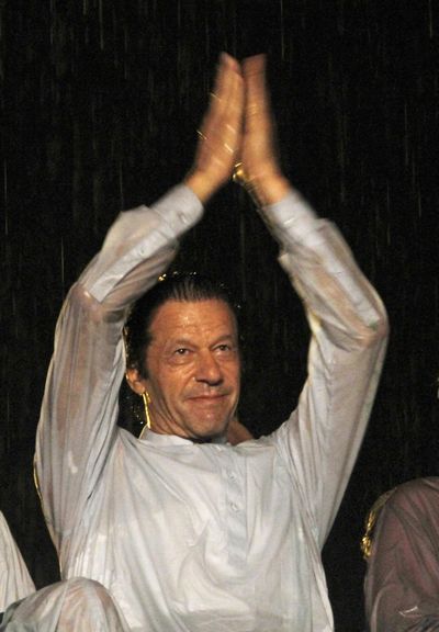 Imran Khan claps for his supporters during an anti-government rally in Islamabad today. (Associated Press)