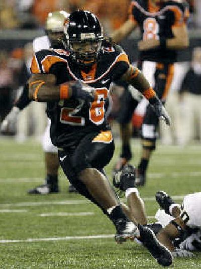 
Oregon State's Yvenson Bernard bulls past Idaho in the first quarter. 
 (Associated Press / The Spokesman-Review)