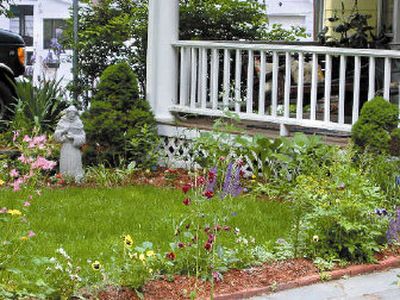 
Planting flowers along walkways can be a great way to create a more welcoming feel to your home while increasing curb appeal.
 (Metro Services / The Spokesman-Review)
