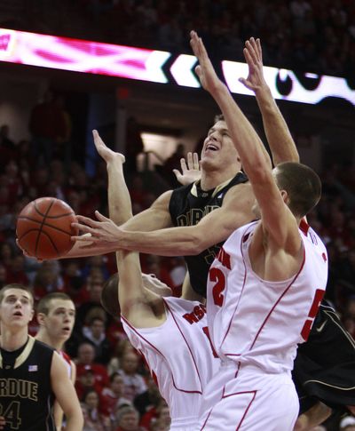 Wisconsin’s Jason Bohannon, left, and Keaton Nankivil double-team Purdue’s Chris Kramer on Saturday.   (Associated Press)