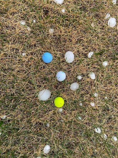 Large chunks of hail or shown in comparison to golf balls in Newman Lake on Thursday, August 11, 2022.  (Treva Lind/THE SPOKESMAN-REVIEW)