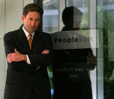 Craig Conway, the president and CEO of business software maker PeopleSoft, the target of a hostile takeover by Larry Ellison of Oracle, was fired Friday.
 (Associated Press / The Spokesman-Review)