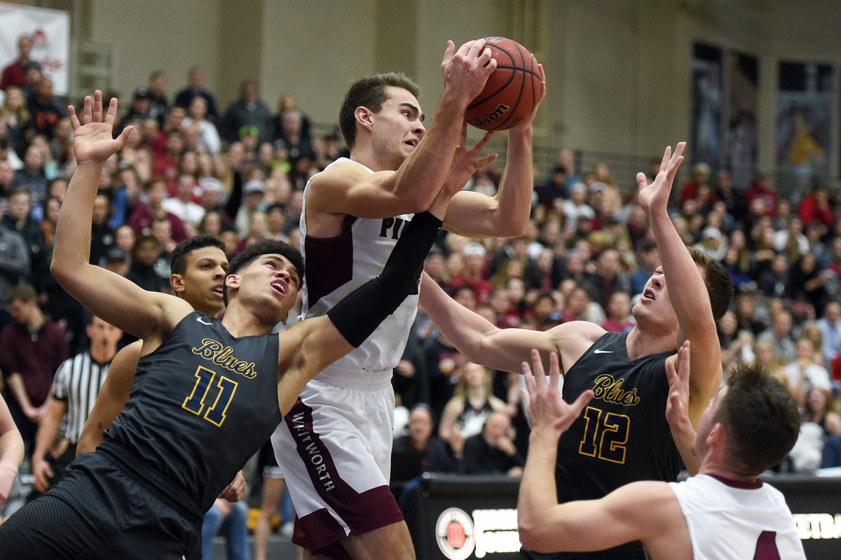 Whitworth Jared Christy (22) grabs a rebound over Whitman Jaron Kirkley (11) during the first half of a college basketball game, Tues., Jan. 8, 2019, at Whitworth University. (Colin Mulvany / The Spokesman-Review)