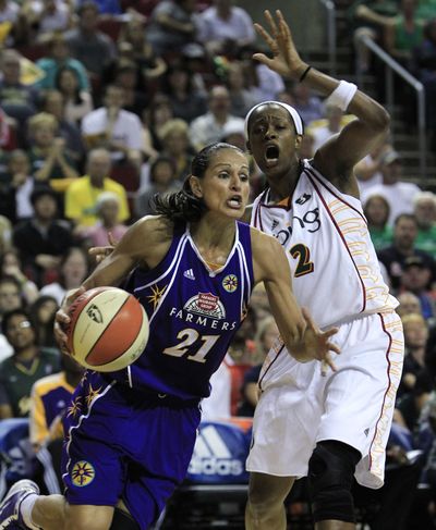 Swin Cash, right, scored 20 points in a Storm playoff win. (Associated Press)