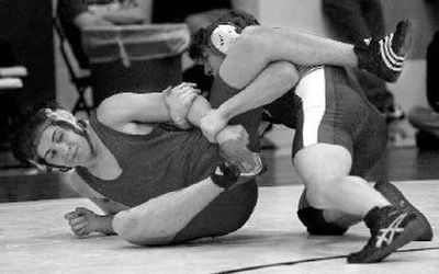 NC's Mike Pursel tries to break free from Mt. Spokane's Noah Hatton in 3A final at 152. Hatton won.
(Ingrid Lindemann / The Spokesman-Review)