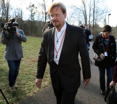 The Rev. Frank Schaefer walks back to his church trial after a lunch break at Camp Innabah, a United Methodist retreat, in Spring City, Pa., on Tuesday. (Associated Press)