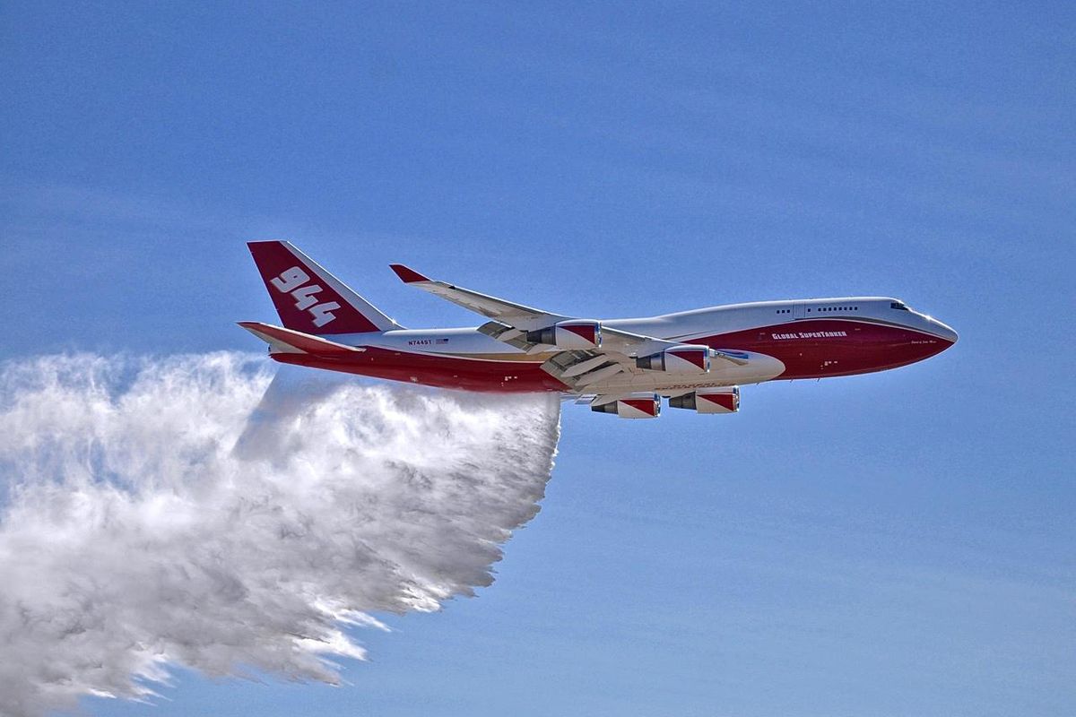 This May 5, 2016,  photo provided by Global Supertanker Services shows a Boeing 747 making a demonstration water drop at Colorado Springs Airport in Colorado Springs, Colo. (Hiroshi Ando / Associated Press)