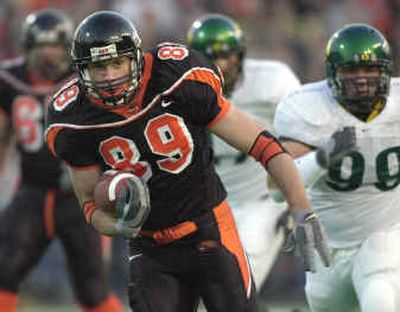 
Oregon State tight end Joe Newton, left, heads downfield after a beating Oregon defender Robby Valenzuela in a first-half pass play.
 (Associated Press / The Spokesman-Review)