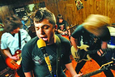
Members of Fanboy, from left, Alan Frisk, Josh Nelson, Ronnie Lee Ross and Ian Nelson,  practice. The group has organized a local rock show next Saturday to benefit three area charities.
 (Kathy Plonka / The Spokesman-Review)