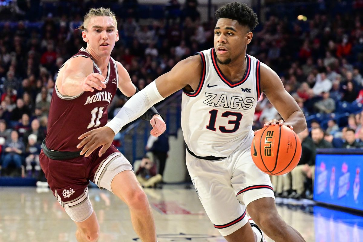 Gonzaga guard Malachi Smith drives against Montana’s Aanen Moody (11) during the first half Tuesday at McCarthey Athletic Center.  (Tyler Tjomsland/The Spokesman-Review)